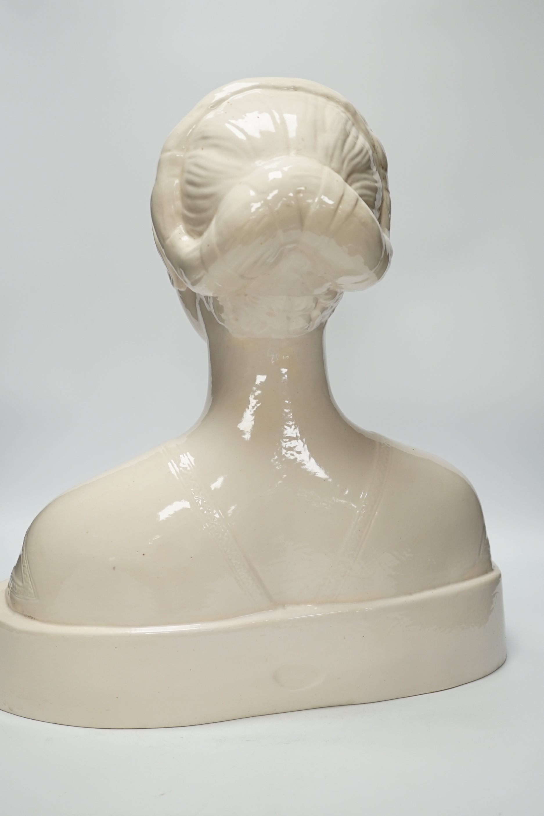 After Francesco Laurana (1430-1502). A tin glazed terracotta bust of Battista Sforza, Duchess of Urbino, 44cm high